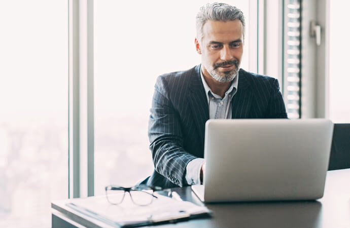 man looking at laptop