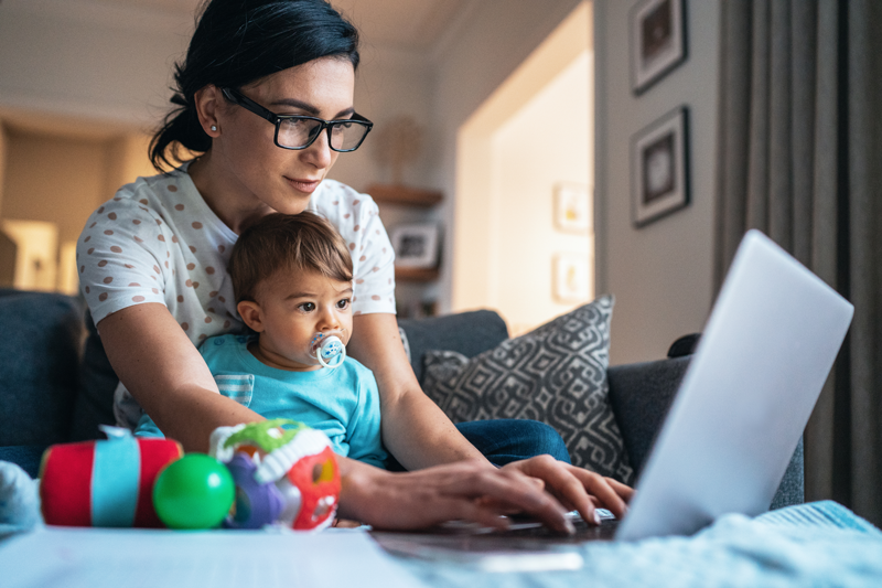 woman with baby at computer