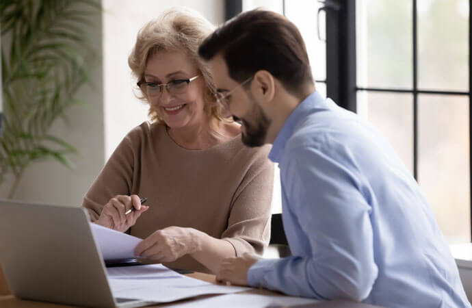 Woman and man on laptop
