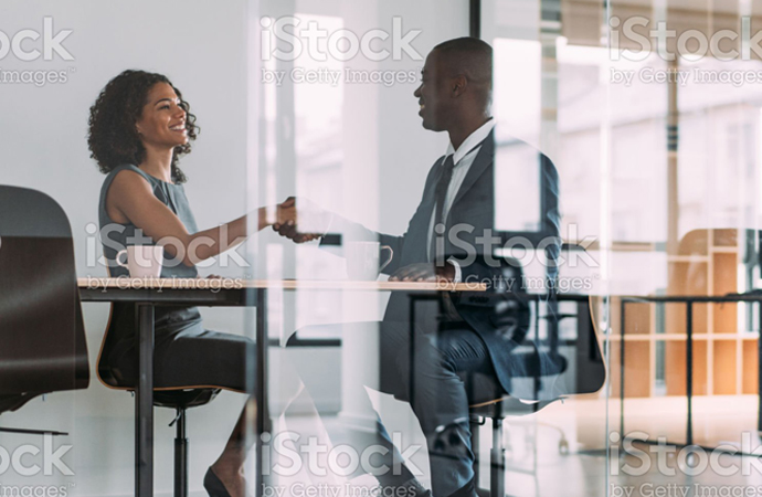 Man sitting reading a tablet