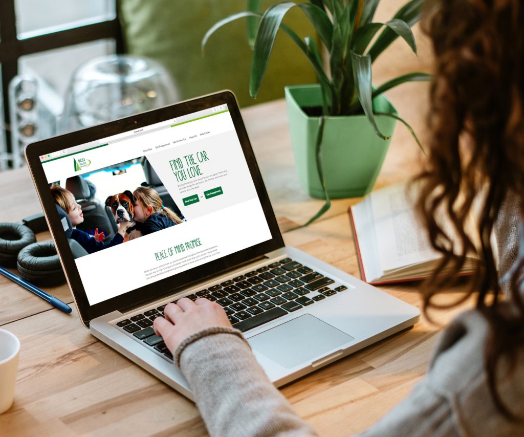 Image of a women browsing RCU's new website in laptop.